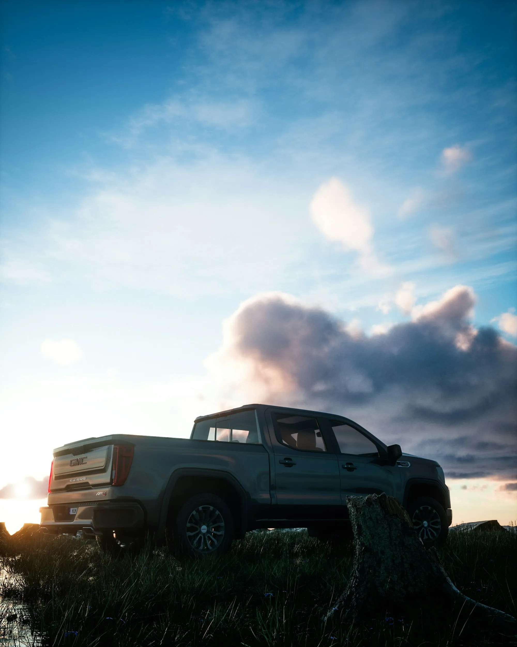 Pickup truck silhouetted on a ridge under a bright sky