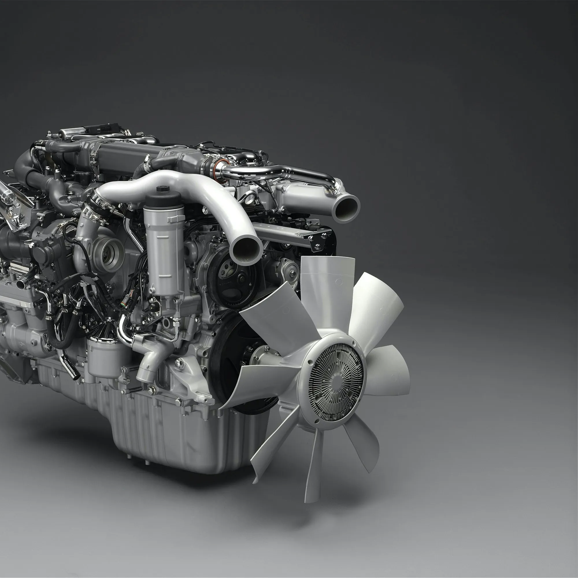 Diesel engine block photographed on a grey background